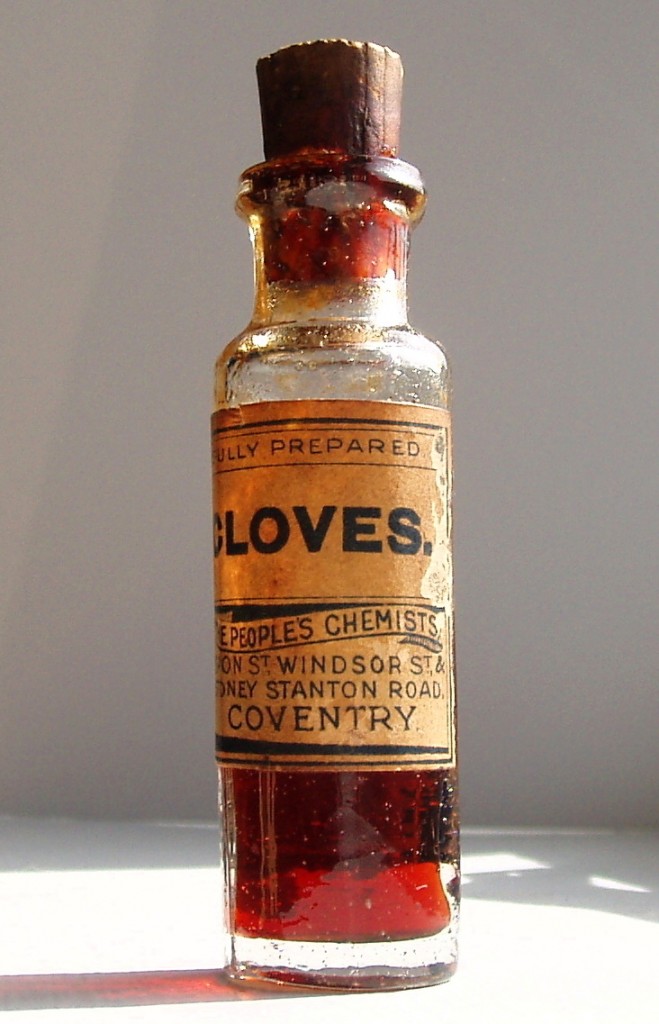 Elderly bottle of oil of cloves sold by a British pharmacy.