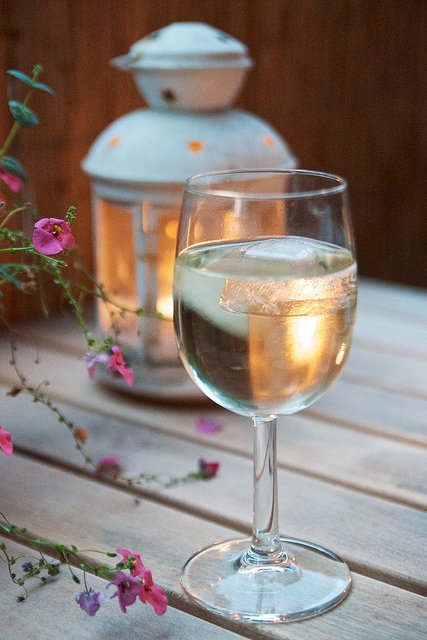 Glass of wine on balcony.