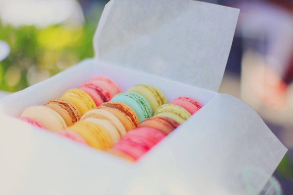 Candy-coloured macarons in a box courtesy of Pixabay.