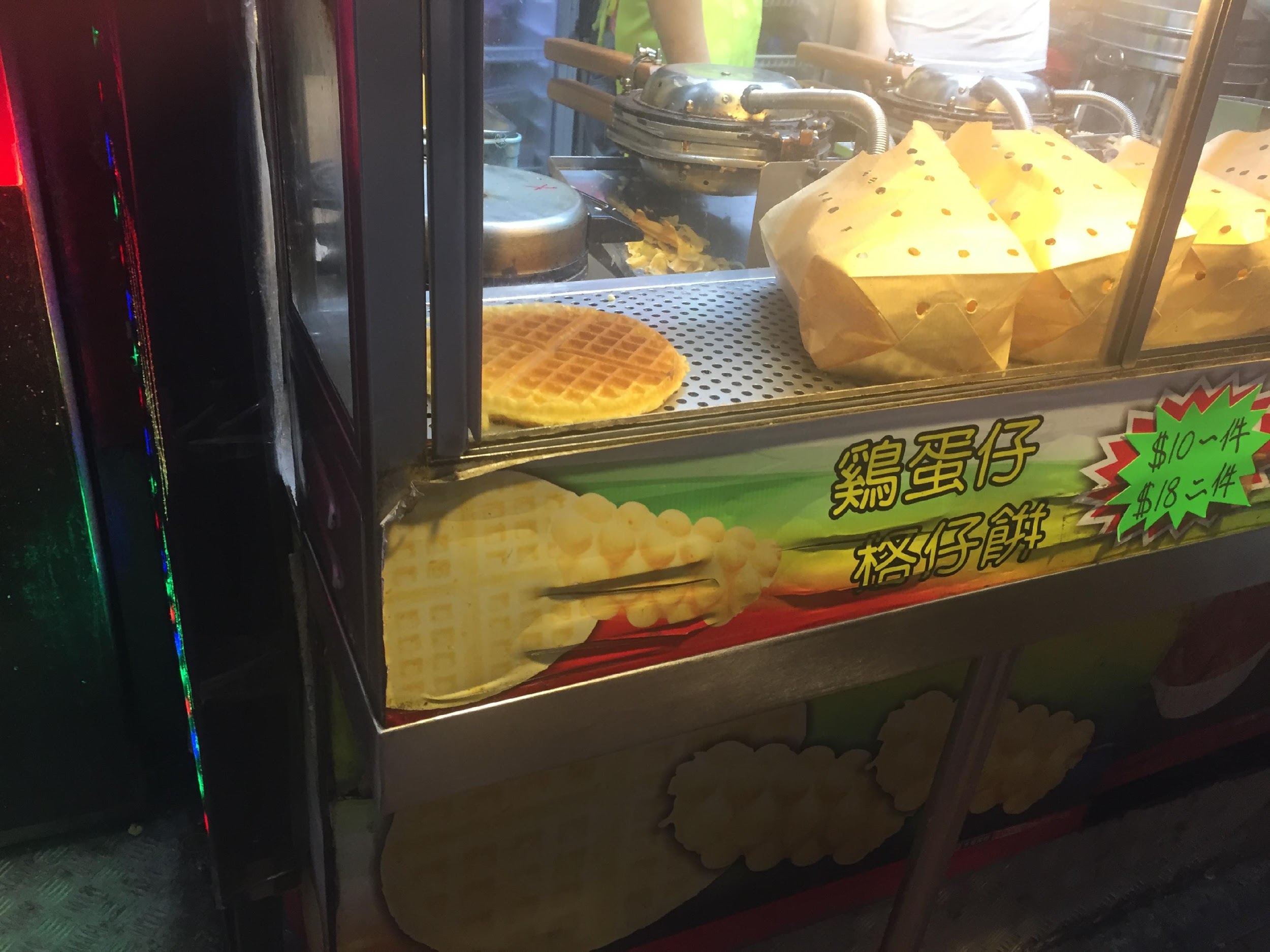 grid cakes for sale in a street stand in hong kong